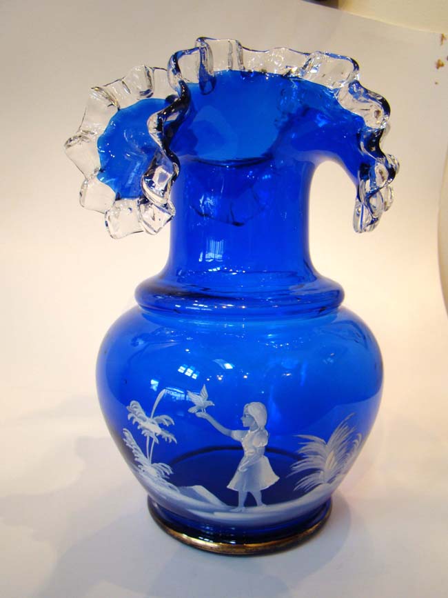 A fabulous Mary Gregory cobalt blue glass vase